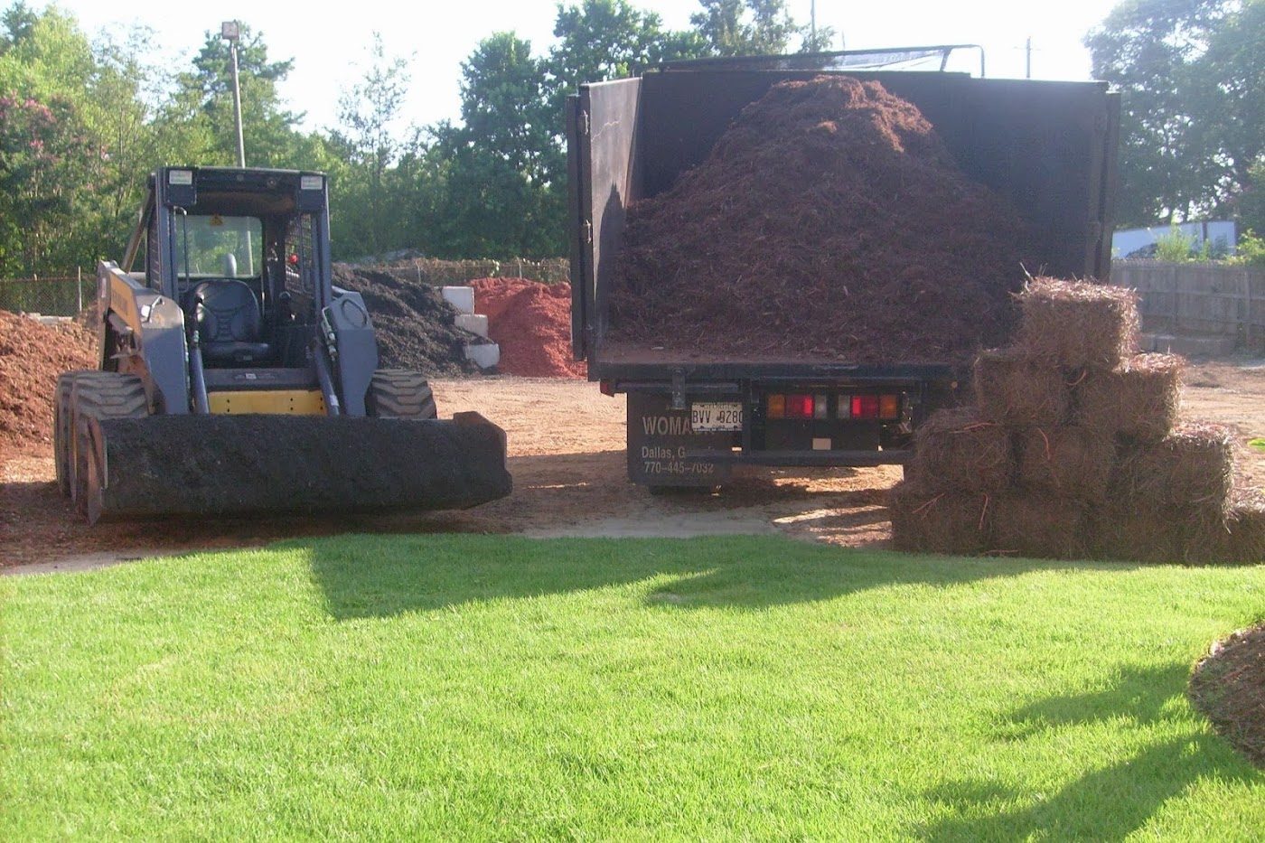 Skid steer and delivery truck with sod